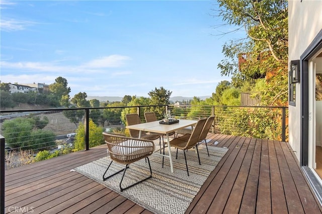 deck with outdoor dining space