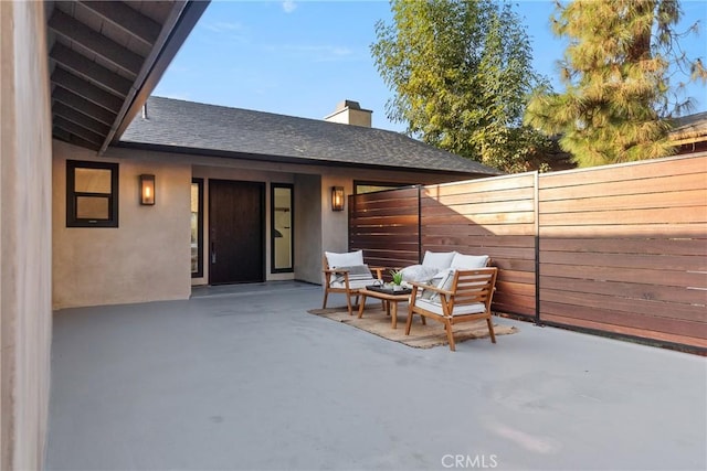 view of patio / terrace featuring fence