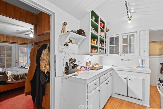 1149 Apple Ave, Wrightwood, CA 92397 - kitchen featuring light countertops, ceiling fan, white cabinetry, a sink, and light wood-type flooring