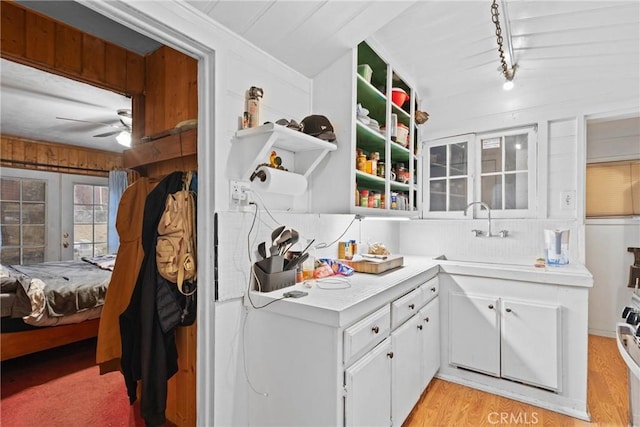 1149 Apple Ave, Wrightwood, CA 92397 - kitchen with light countertops, a sink, a ceiling fan, white cabinetry, and light wood-type flooring