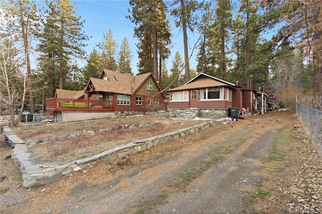 1149 Apple Ave, Wrightwood, CA 92397 - view of front facade with driveway, fence, and a wooden deck