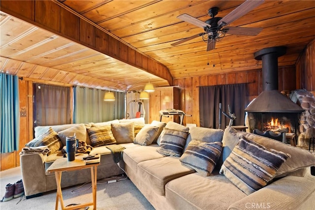 1149 Apple Ave, Wrightwood, CA 92397 - cinema room featuring a wood stove, wood ceiling, carpet floors, wooden walls, and a ceiling fan