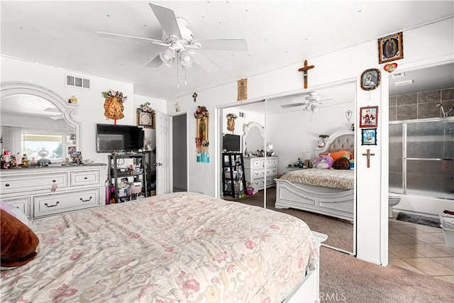 bedroom featuring tile patterned floors, ceiling fan, and a closet