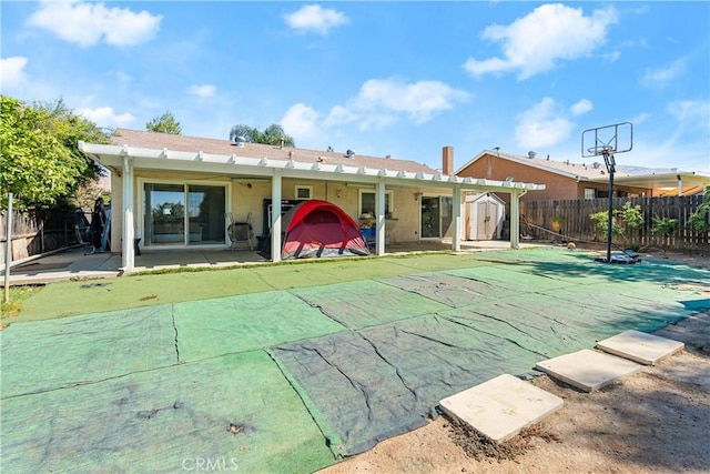 rear view of house featuring a patio and a pergola