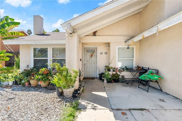 property entrance with a patio area