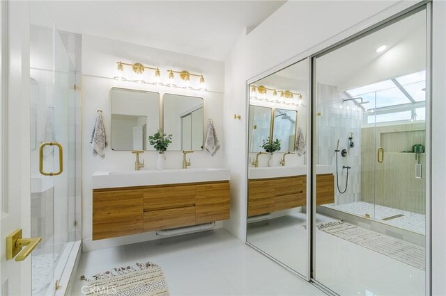 full bathroom featuring tile patterned flooring, a stall shower, and vanity