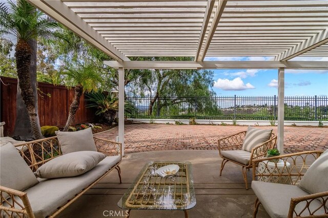 view of patio / terrace featuring a pergola and a fenced backyard