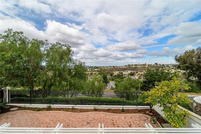 view of property's community featuring fence