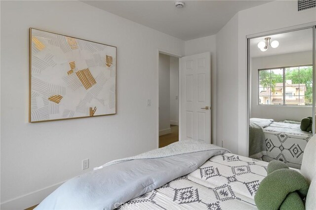 bedroom featuring visible vents