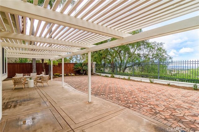 view of patio with a fenced backyard and a pergola