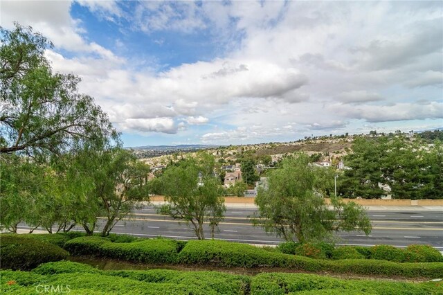 view of community featuring uncovered parking