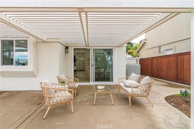 view of patio with central air condition unit, a pergola, and fence