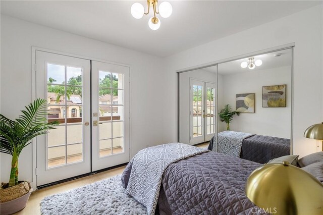 bedroom featuring access to outside, french doors, and a closet