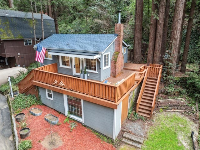 back of house with a wooden deck