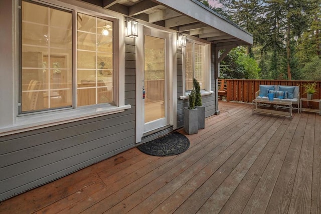 wooden deck with outdoor lounge area