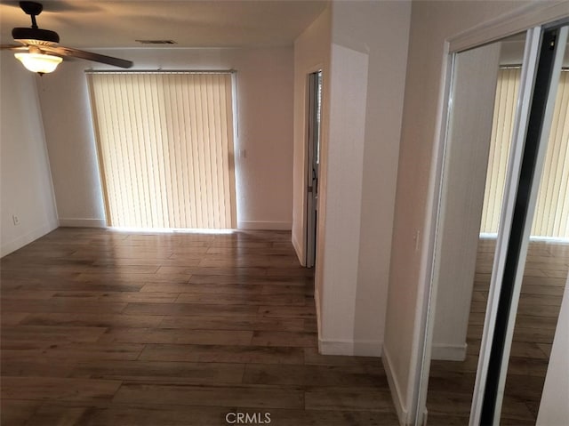 corridor featuring dark hardwood / wood-style flooring