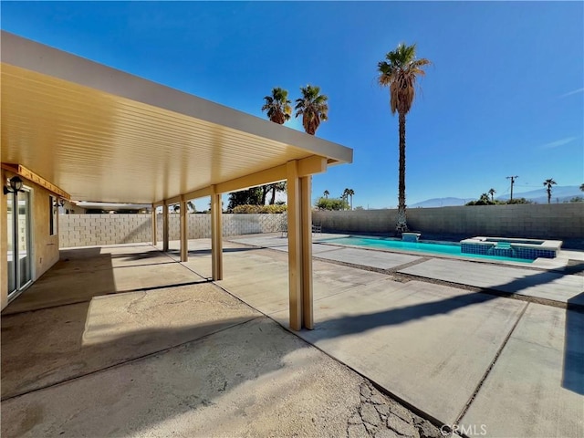 view of patio featuring a fenced in pool