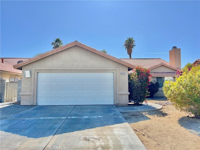 ranch-style house featuring a garage