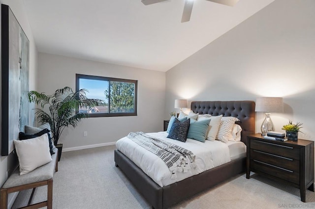 bedroom featuring ceiling fan, lofted ceiling, and light colored carpet