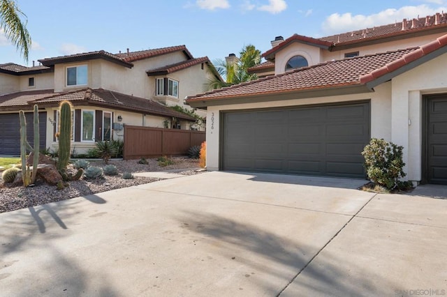 mediterranean / spanish home with a garage