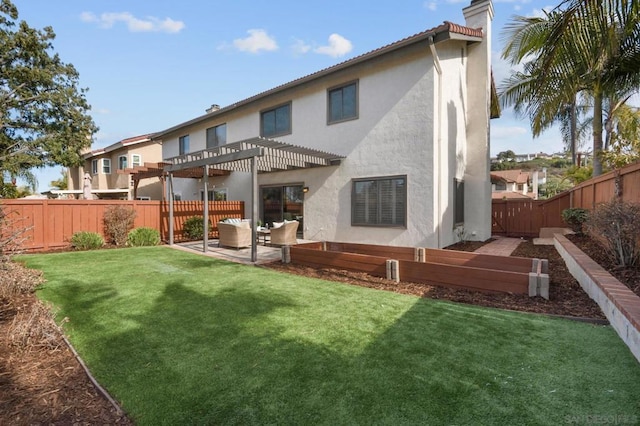 rear view of house featuring a lawn, a patio area, and a pergola