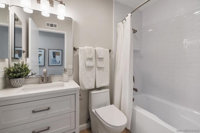 full bathroom with shower / bath combination with curtain, vanity, and toilet