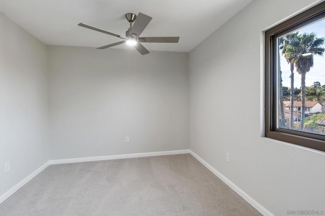 unfurnished room with light carpet and ceiling fan