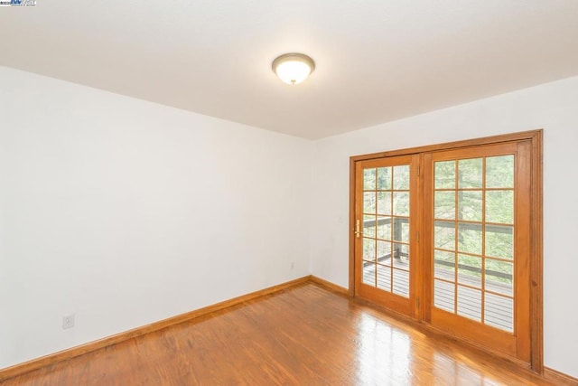 unfurnished room featuring wood-type flooring