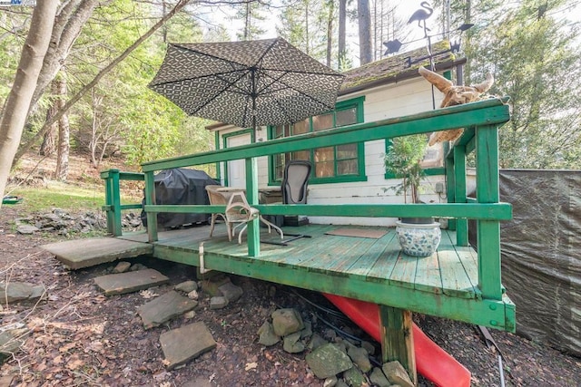 wooden terrace with area for grilling