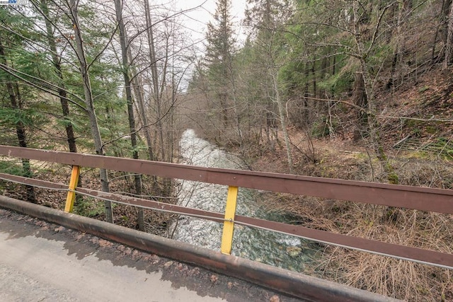 view of gate featuring a water view