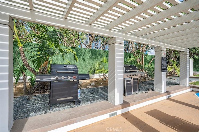 view of patio / terrace with a pergola and grilling area