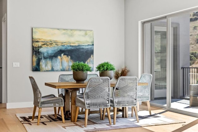 dining area with light wood-type flooring