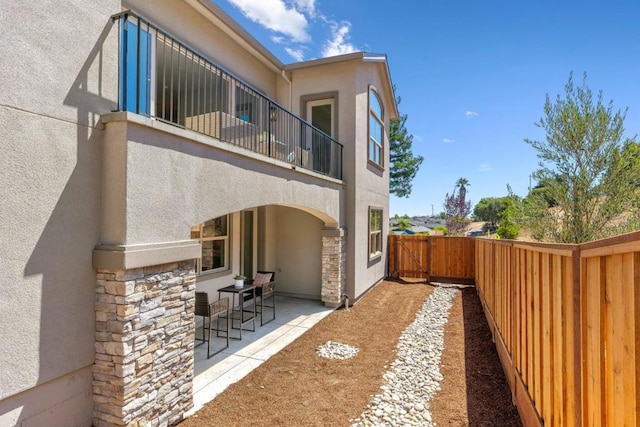 back of property with a patio