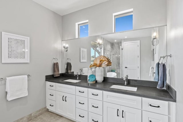 bathroom featuring vanity and a shower with shower door