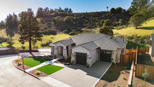 view of front facade with a garage and a front yard