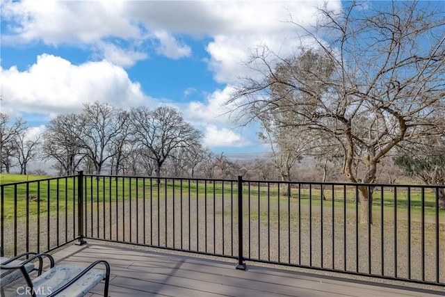 wooden deck with a lawn