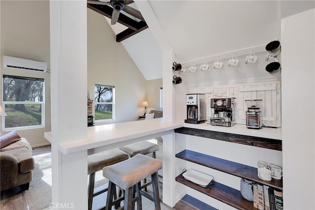 bar with high vaulted ceiling, beam ceiling, carpet floors, and an AC wall unit