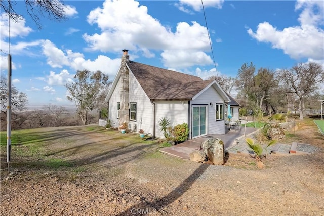 view of property exterior with a patio