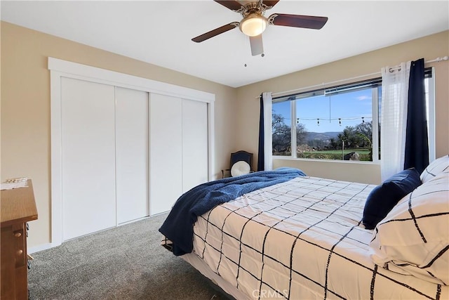 bedroom featuring a closet, ceiling fan, and carpet flooring