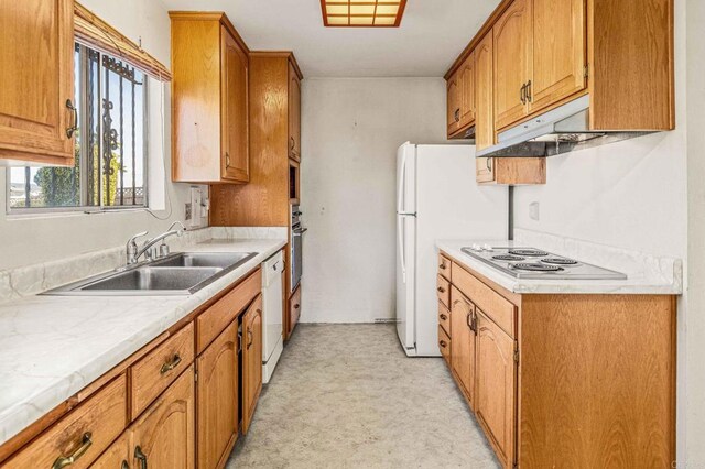 kitchen featuring sink and white appliances