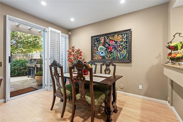 dining area with light hardwood / wood-style floors