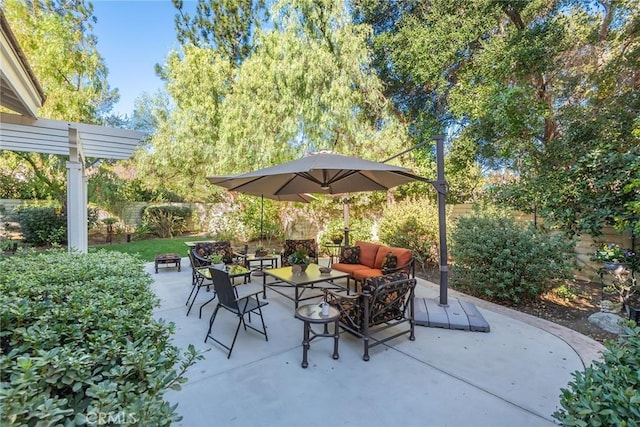view of patio / terrace featuring a fenced backyard and an outdoor living space