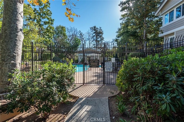 view of gate with fence