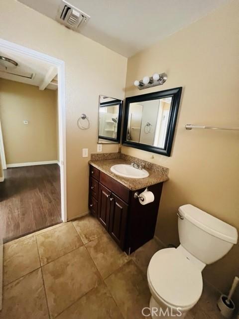 bathroom with vanity and toilet