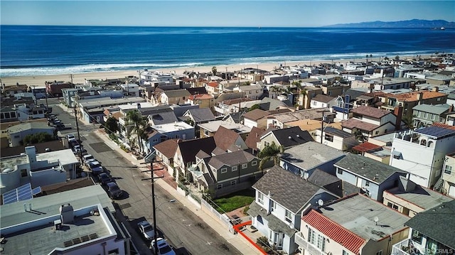 aerial view featuring a water view and a beach view