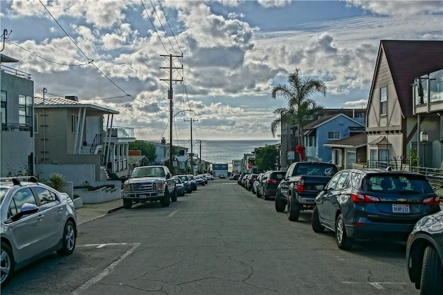 view of parking with a water view