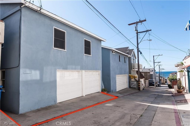 view of side of home with a garage