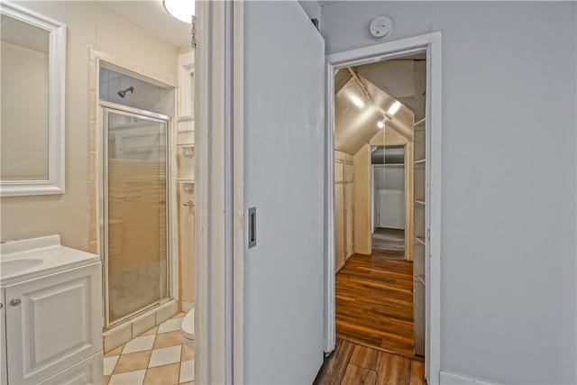 259 28th St, Hermosa Beach, CA 90254 - bathroom featuring a shower stall, toilet, vanity, and wood finished floors