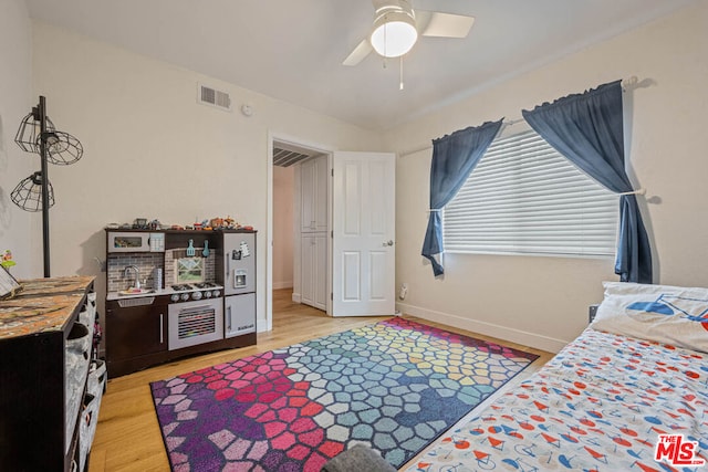 bedroom featuring ceiling fan and light hardwood / wood-style floors