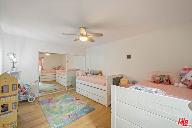 bedroom featuring light wood-type flooring and ceiling fan